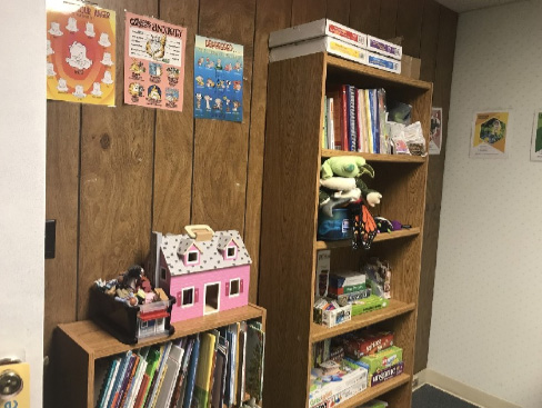 Play Therapy books and toys in a room at Butterfly Beginnings Counseling