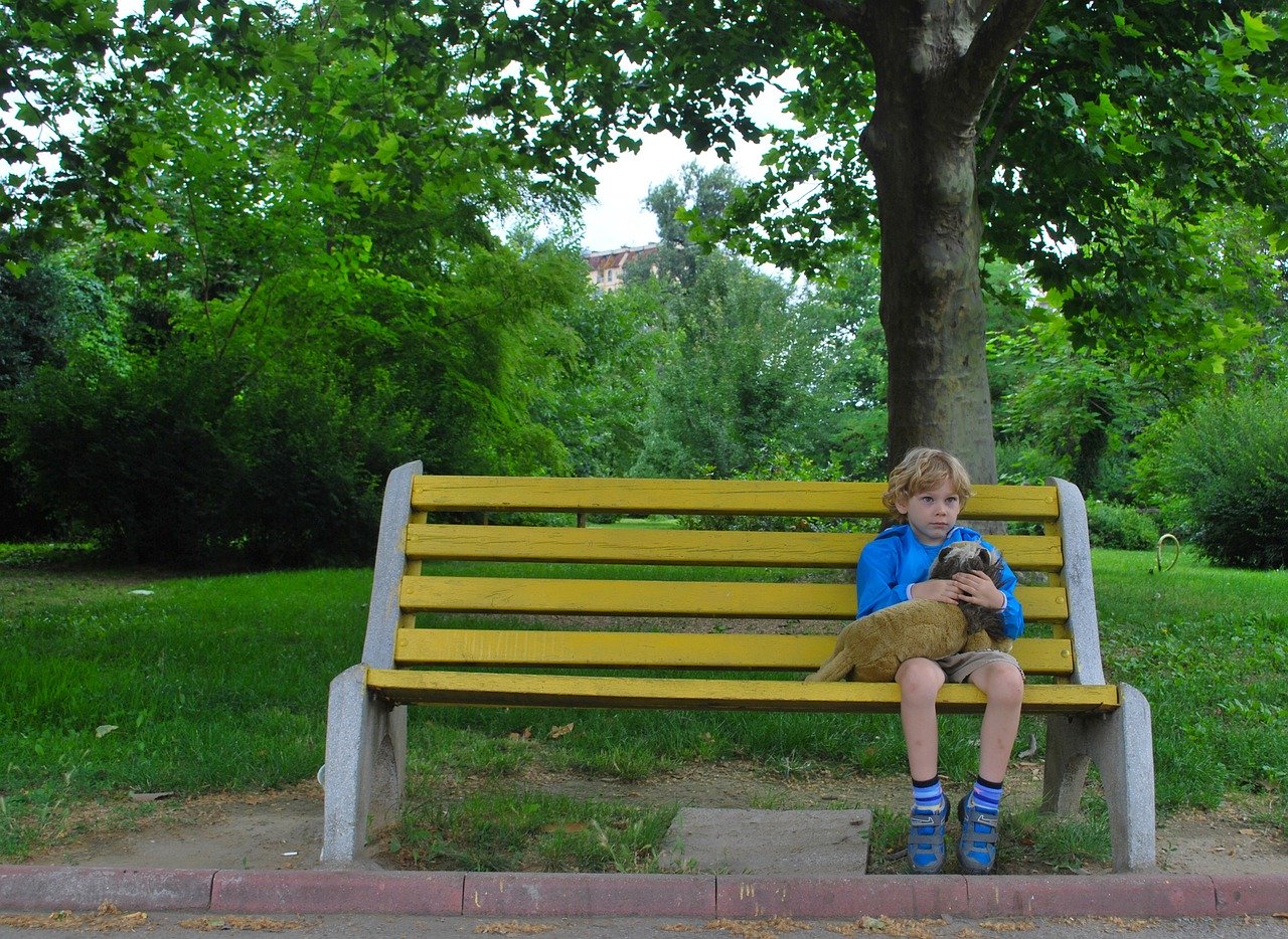 Sad child on bench for tips on coping with change from Butterfly Beginnings Counseling and Play Therapy in Davenport, Iowa